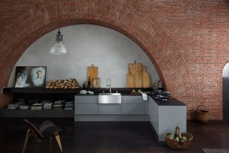 Kitchen with steel-sink built into an old church