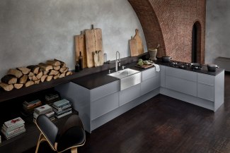 Kitchen with steel-sink built into an old church