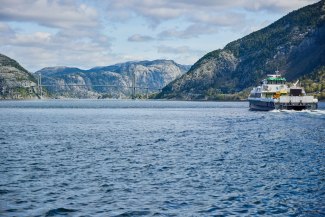 DHL-van on ferryboat in norwegian fjord