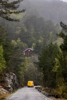DHL van driving in norwegian forrest