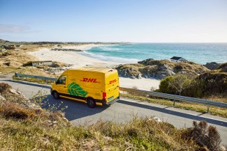 DHL van driving along coastline