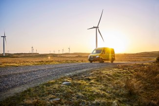 DHL van driving through windmill-park