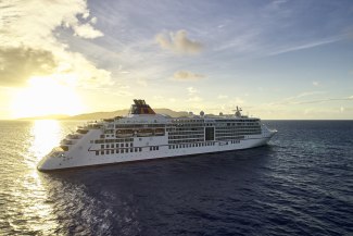 Cruiseship Europa 2 in the indian ocean in front of sunset