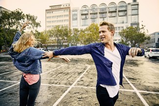 young couple dancing in Capetown in drizzle rain