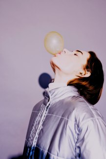 girl with silver snowjacket and bubble