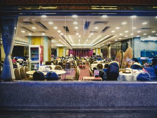 one night in Hong Kong view through the window into a chinese restaurant
