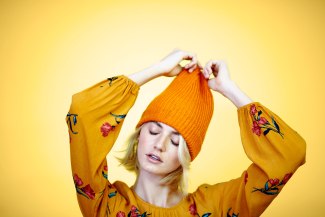 young woman with yellow beanie