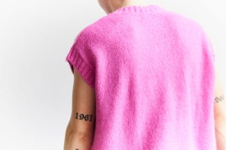 young man with pink pullover