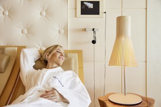 woman lies in relax area of spa