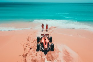 two men on the beach with their racingcar