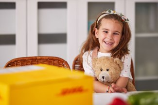 young girl enjoying a DHL shipment