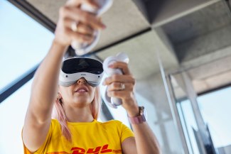 DHL employer is working by wearing VR galsses