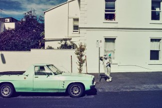 new shark in town by Bernd Opitz a man in sharkcostume is checking the taximeter