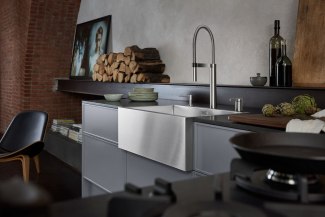Kitchen with steel-sink built into an old church
