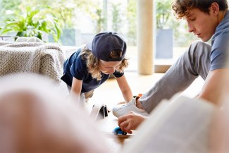 father and son playing on the floor in their living room