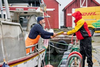 DHL express delivery to a fisherman in the harbor