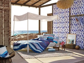 ESPRIT Home huts bedlinen in an open hut on the beach
