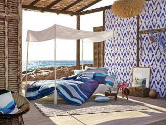 bedlinen in an open hut on the beach