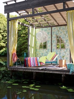 a decorated hut at a lakeside