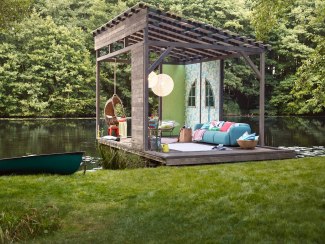 a decorated hut at a lakeside