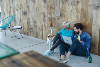 two young offive employer sitting on ground