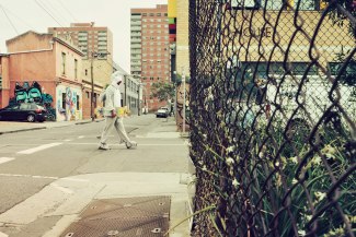 man in a sharkcostume is walking through Melbourne