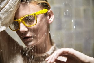 girl with yellow glases under a shower