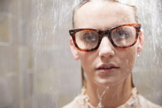 portrait of girl with glases under the shower