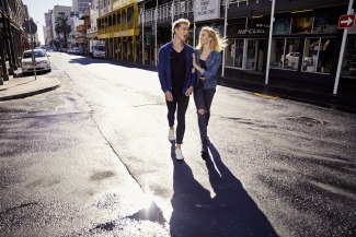 young couple crossing a street in Capetown