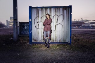 girl standing in front of a container