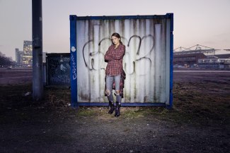winterflower girl standing in front of a container