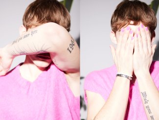 young man with pink pullover