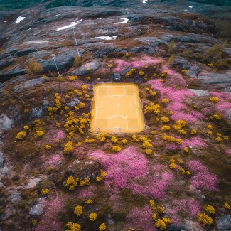 yellow basketballground in stony landscape