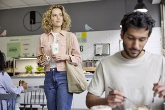 young woman walking through breakfastroom