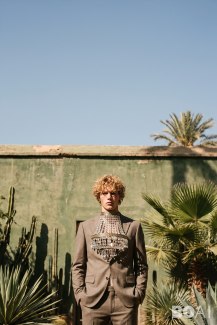 yound man with a candlelaber around his neck