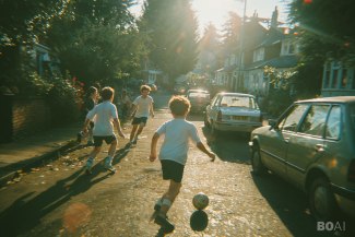 a group of young boys playing foootball